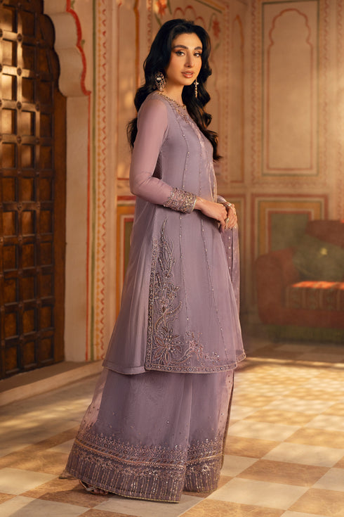 Side profile highlighting back slit and vertical adda embroidery on the frock’s panel edge